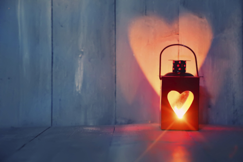 Valentine's Day lantern with heart illuminated on wall