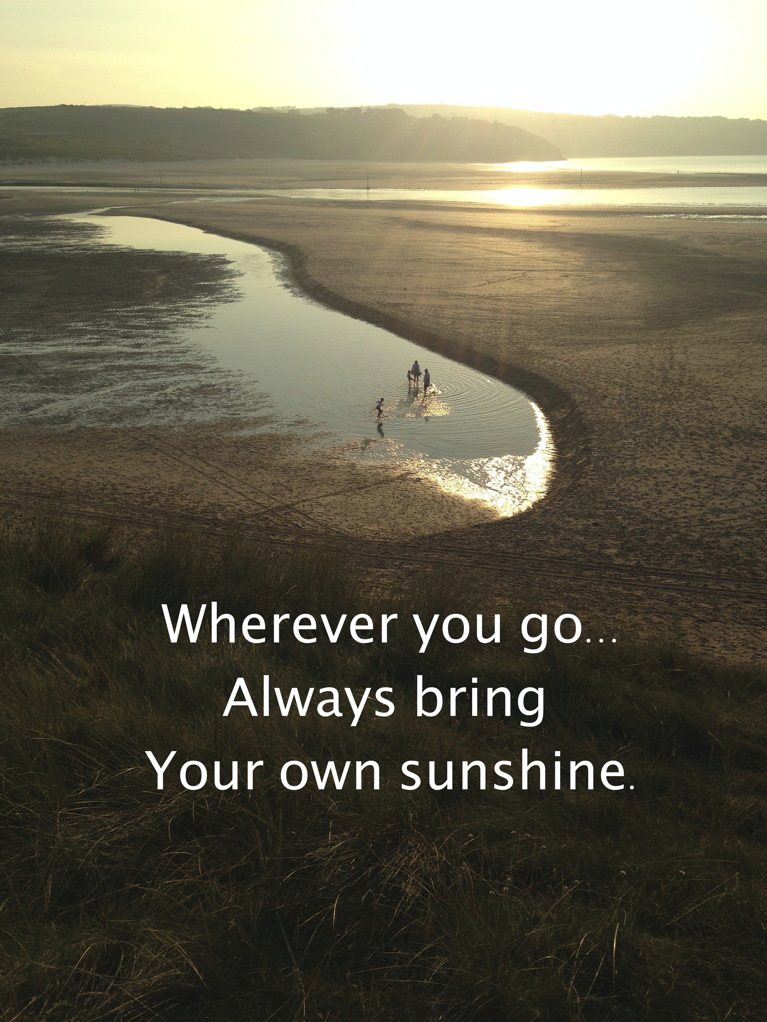 Quote against backdrop of beach bathed in sunshine: Wherever you go always bring your own sunshine